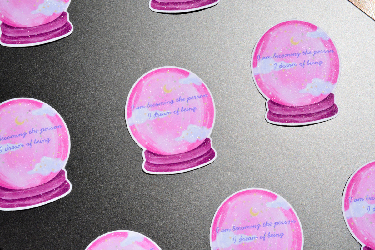 Crystal ball stickers showcased on the grey surface