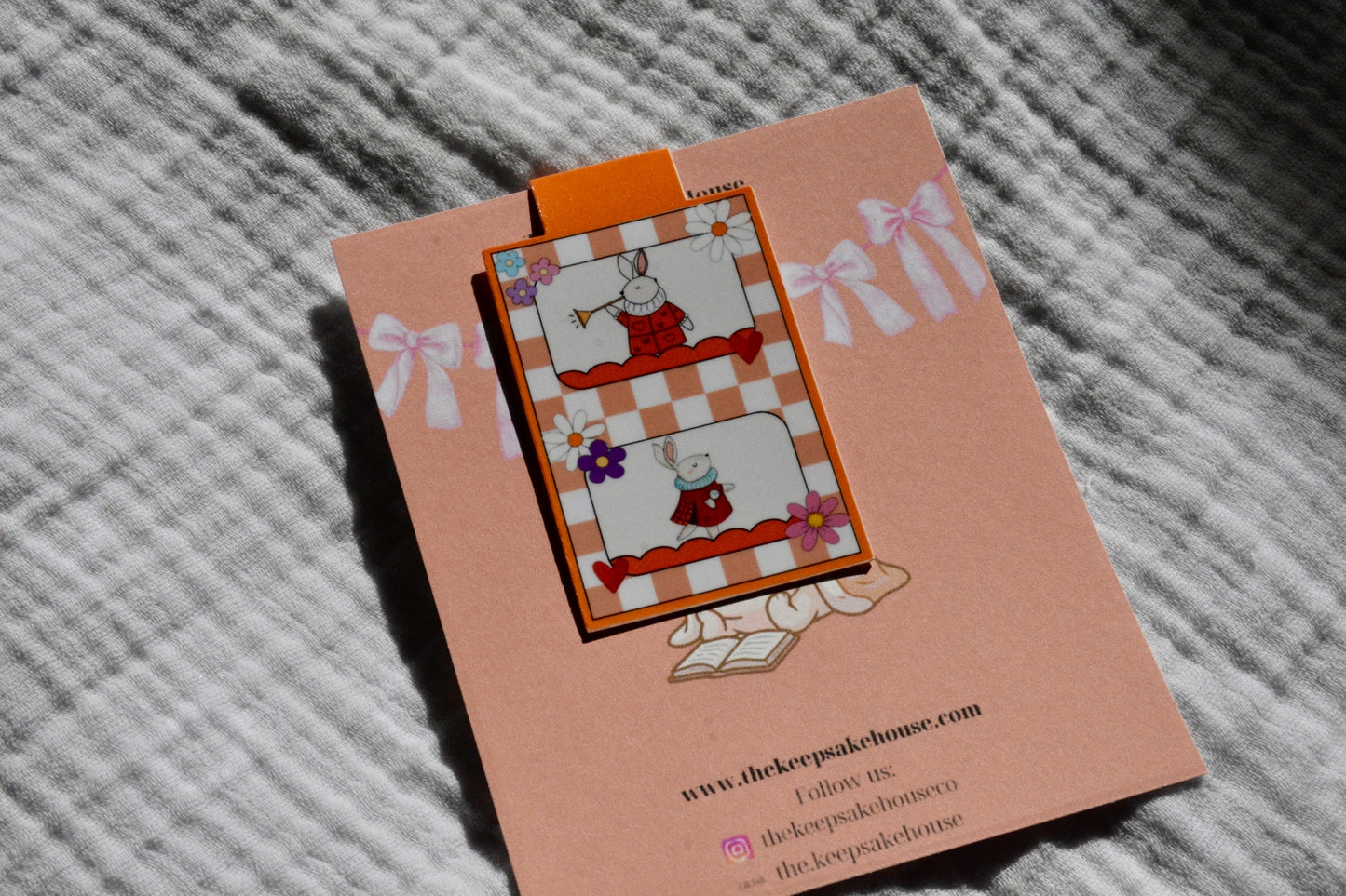 Handmade late bunny magnetic bookmark with trumpet and red checkered design on a peach Keepsake House backing card