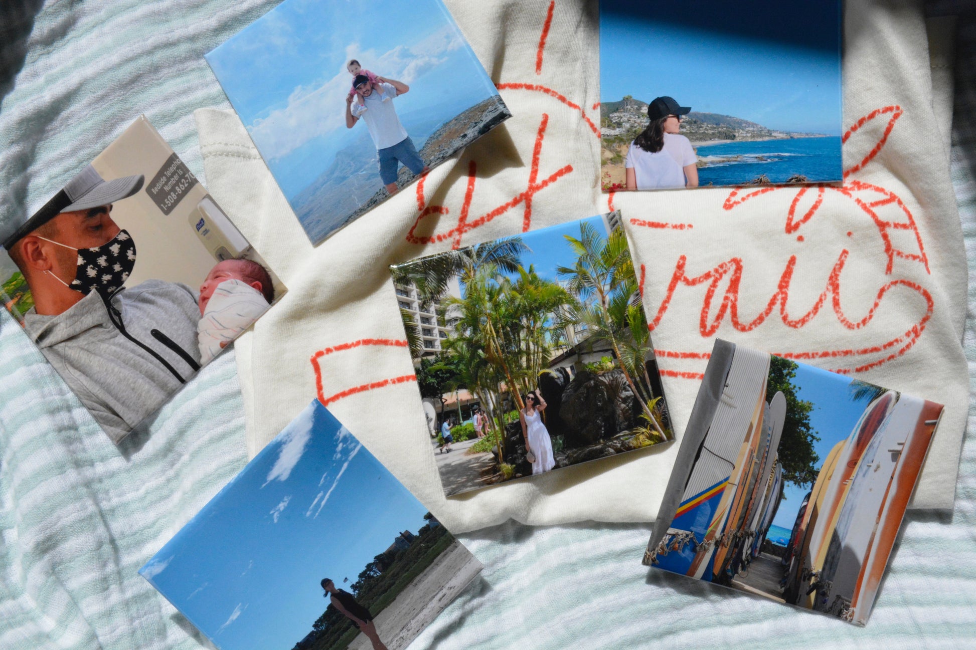 Personalized photo magnets with Hawaii travel photos on fabric background