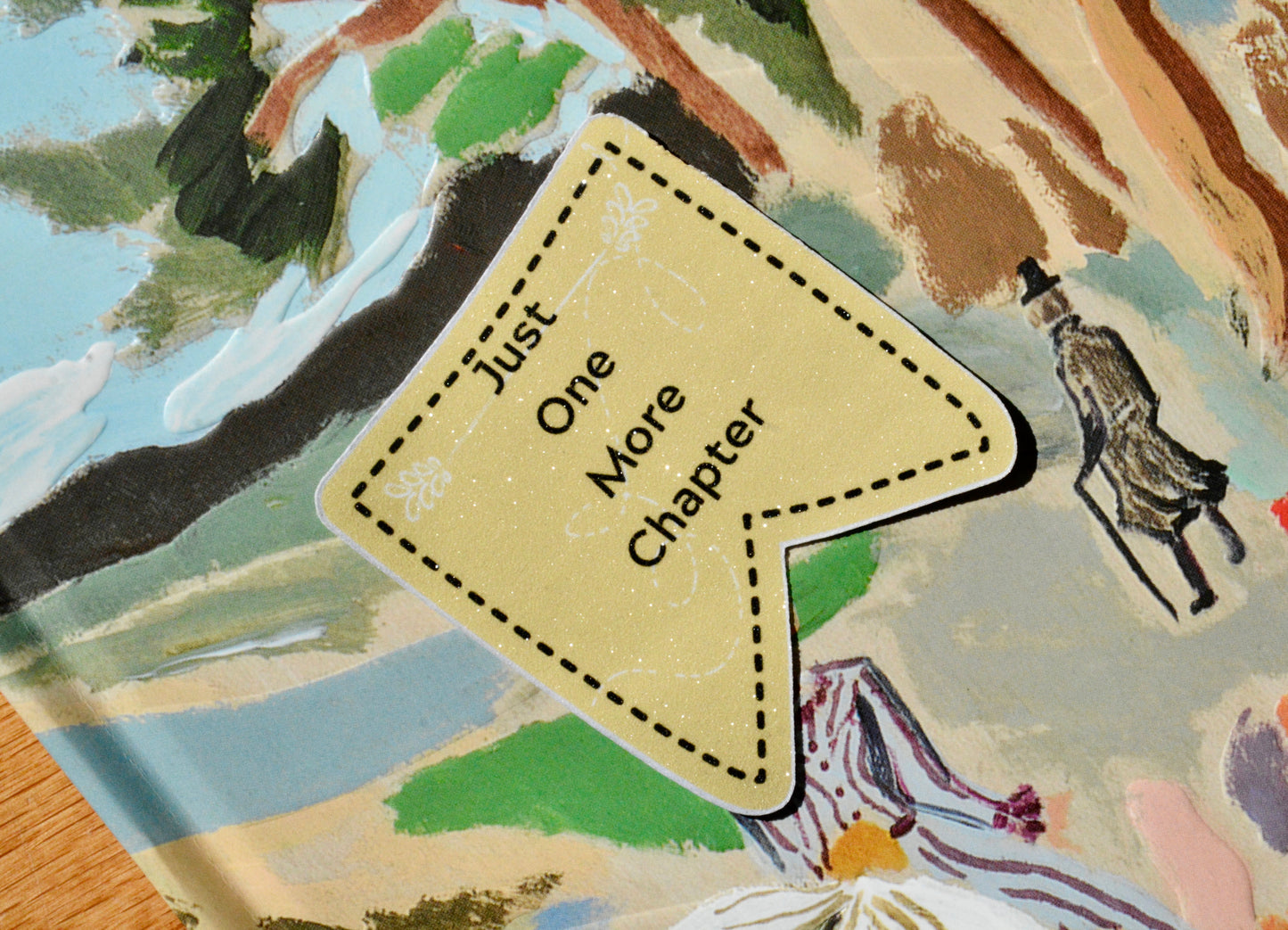 Just One More Chapter Written on Sticker with a colorful background