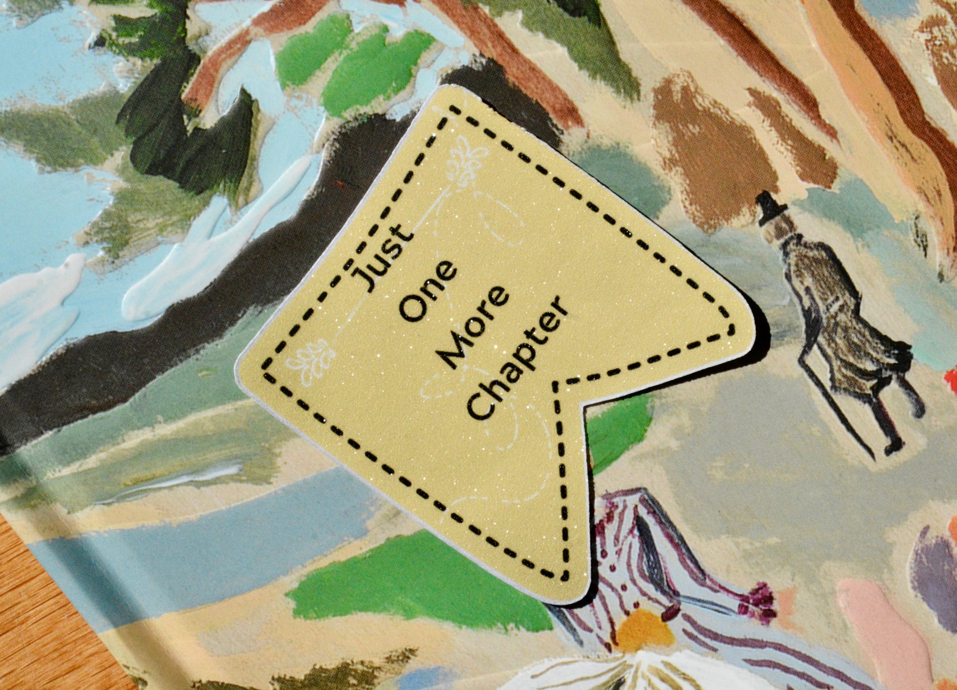 Just One More Chapter Written on Sticker with a colorful background