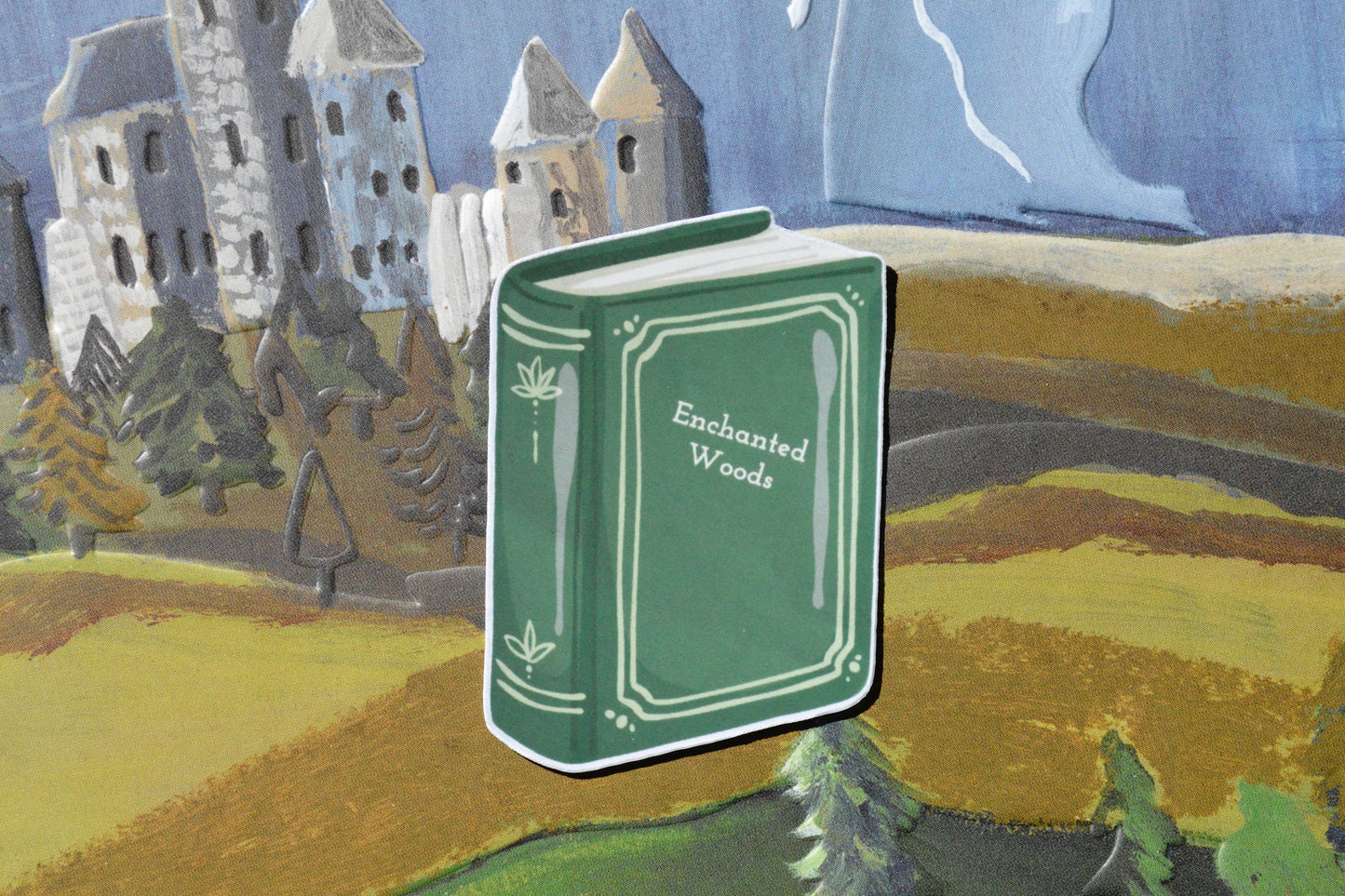small ticker book with the name "enchanted woods"