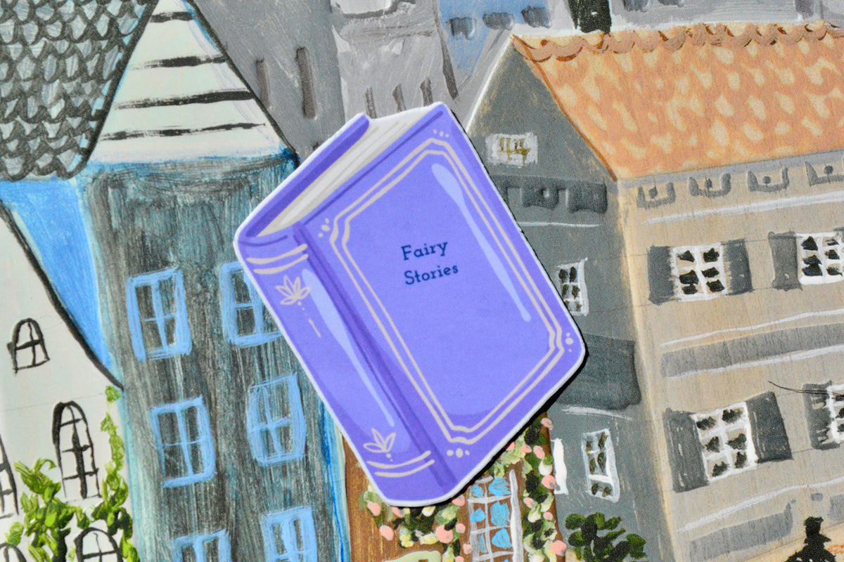 lavender colored small sticker book named fairy stories