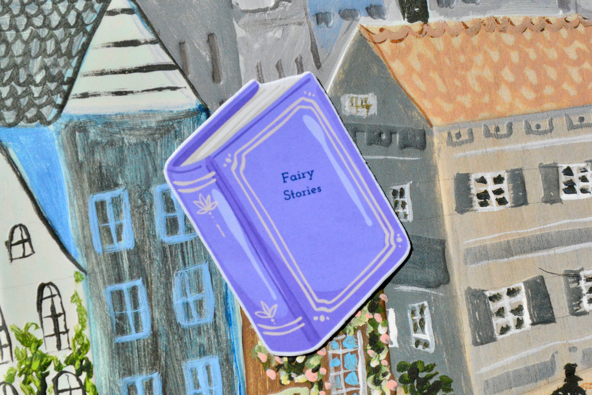 lavender colored small sticker book named fairy stories
