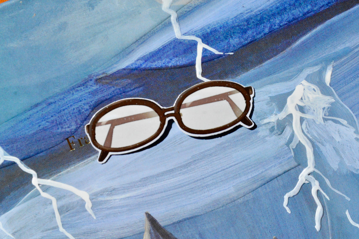 Reading Glasses Sticker on a bluish background