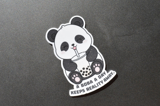 Happy panda on a sticker that says a boba a day keeps reality away
