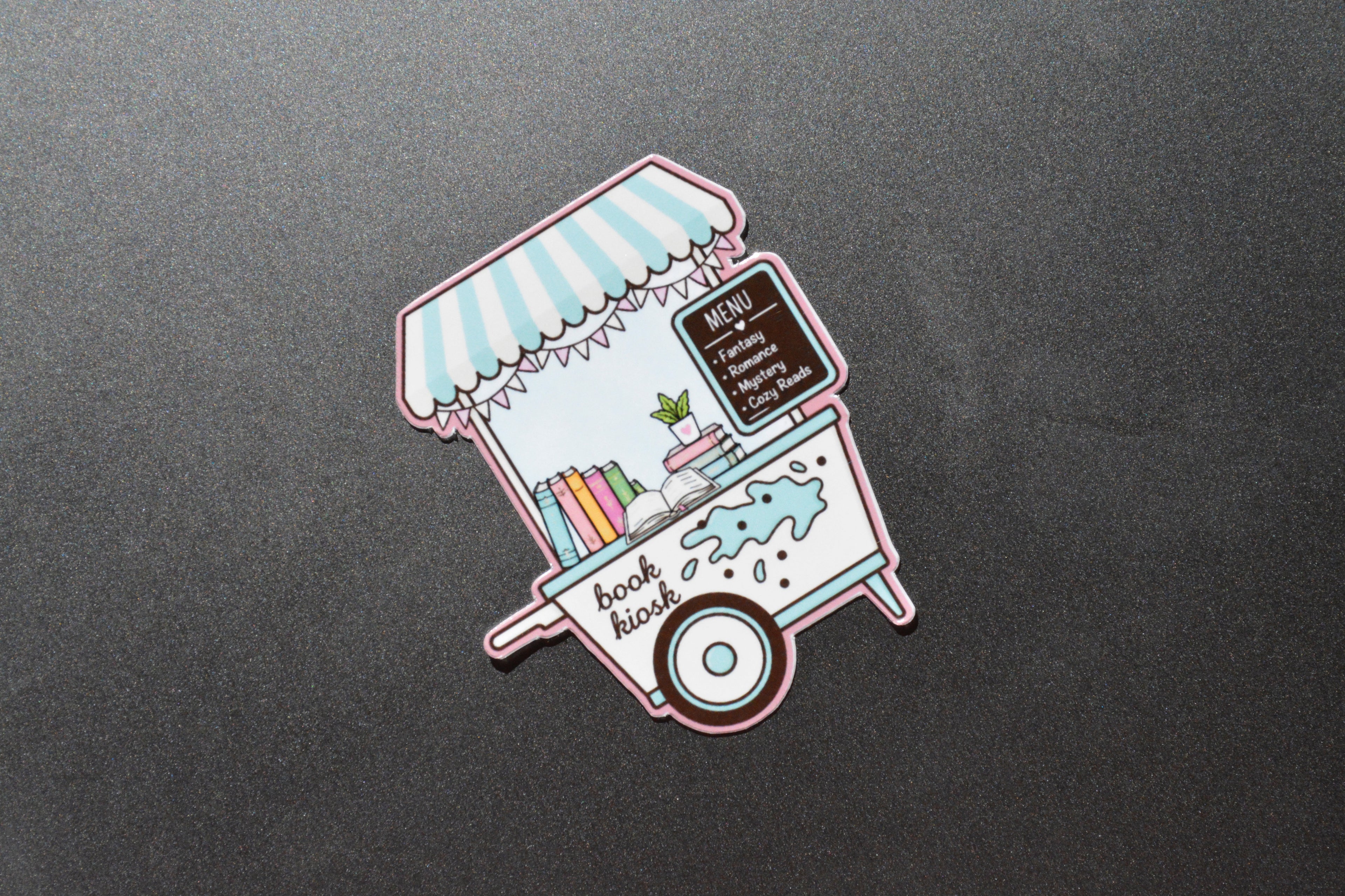 Book kiosk Waterproof Sticker showcased on Ipad