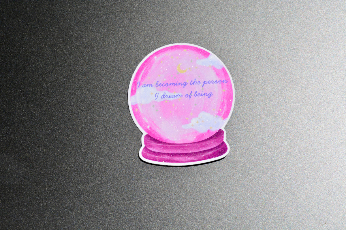 The sticker shows the text "I am decoming the person I dream of being"