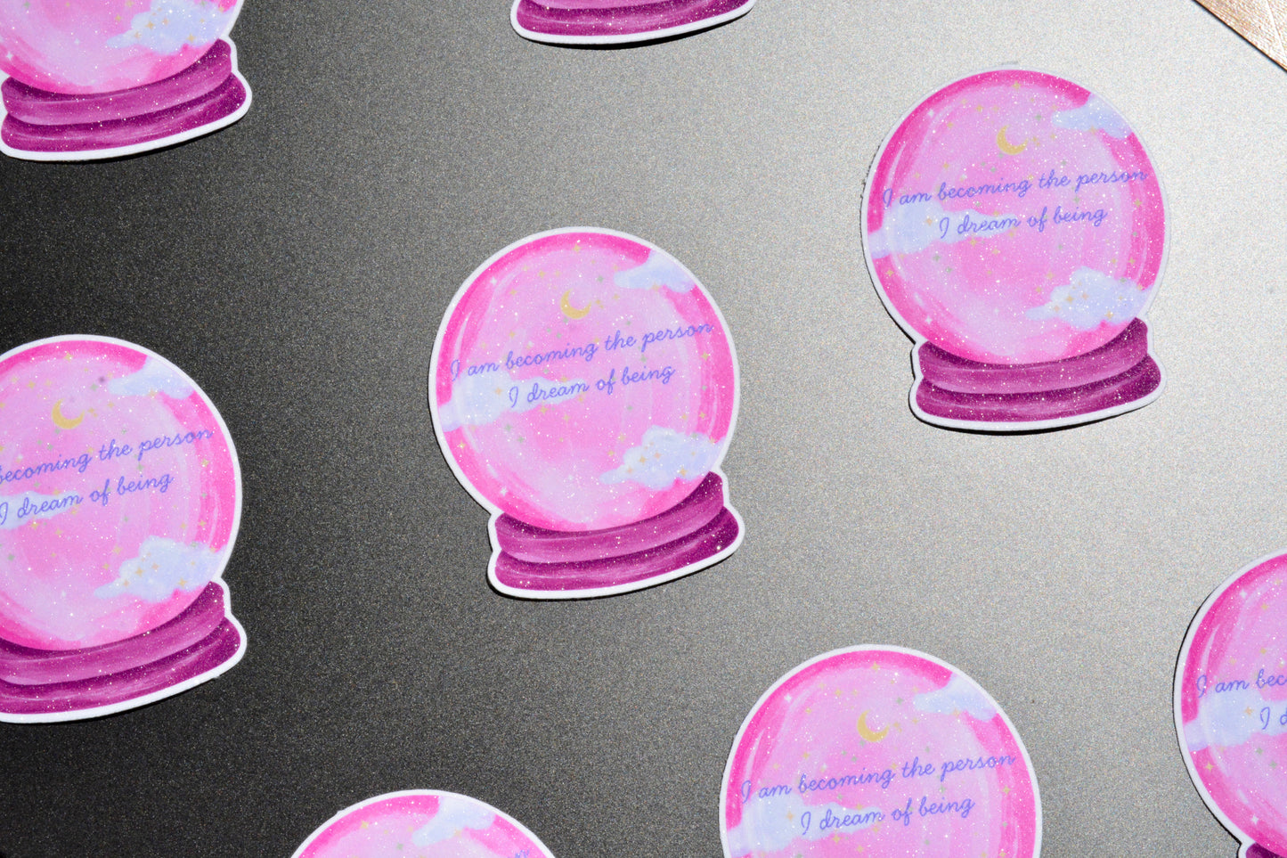 Crystal ball stickers showcased on the grey surface