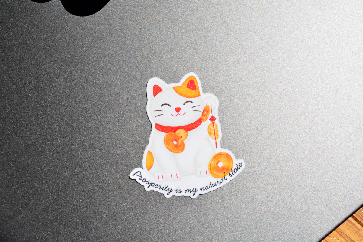 Lucky Cat Prosperity sticker is on laptop