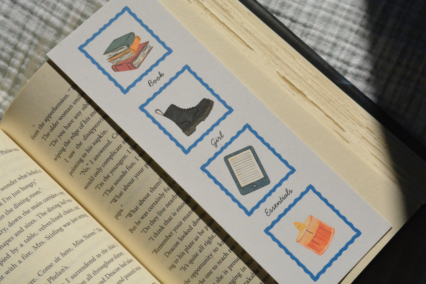 Handcrafted oversized linen bookmark displaying different bookish essentials on each side for everyday readers.