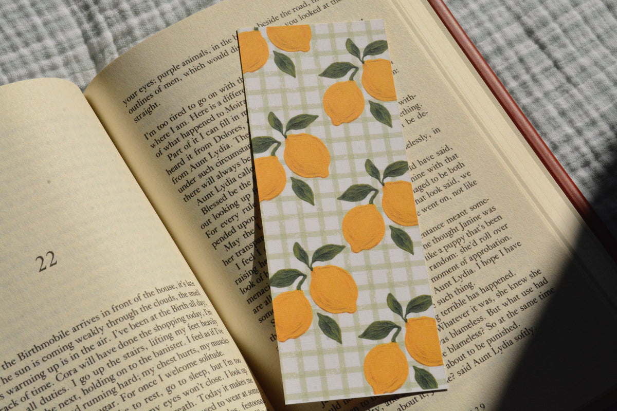 Premium linen bookmark featuring a charming lemon design, available with square or rounded corners.