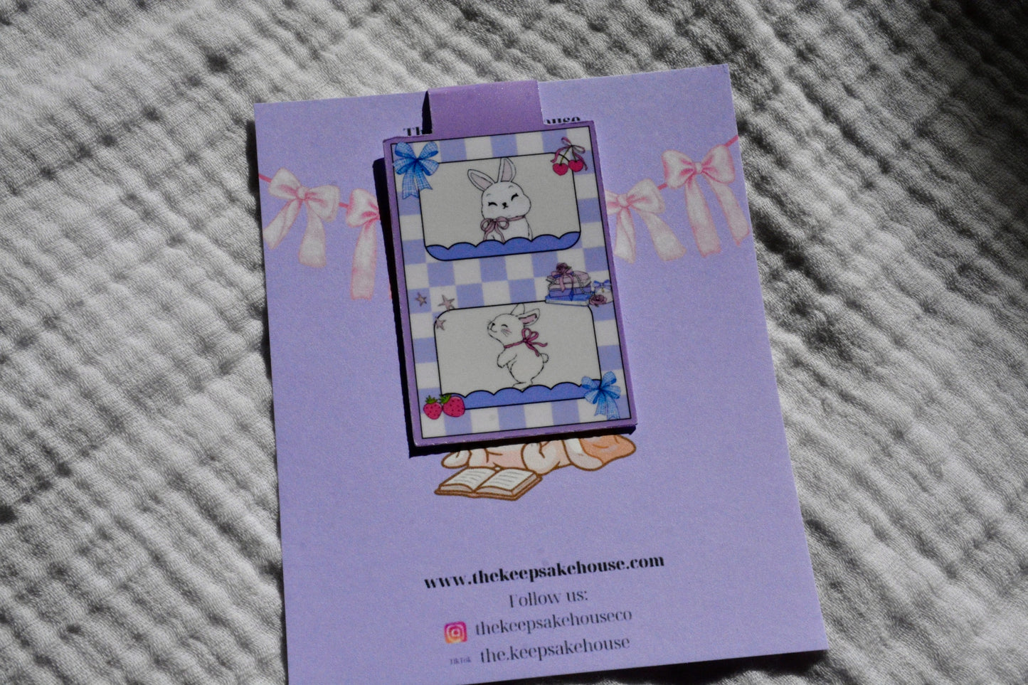 Handmade bunny magnetic bookmark with blue checkered design on a lavender Keepsake House backing card