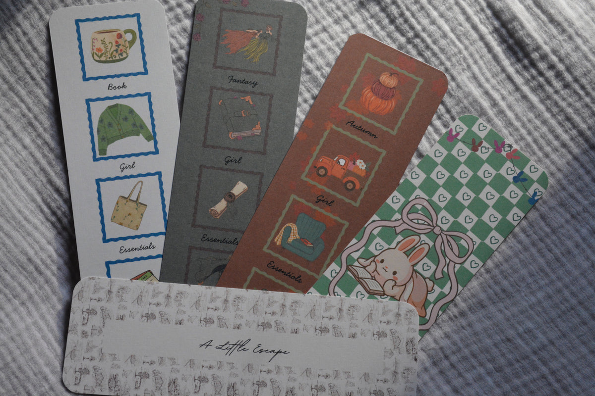 fanned out 5 linen bookmarks on grey background