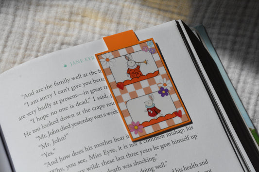 Cute reading bunny magnetic bookmark clipped to a book page, adorable book lover gift for readers and students