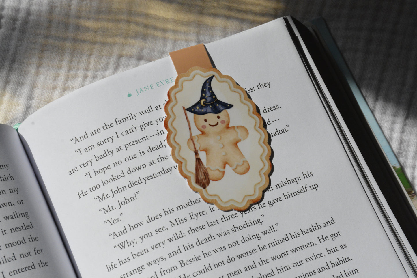 Handmade magnetic bookmark featuring a wizard gingerbread character design on a pink Keepsake House backing card