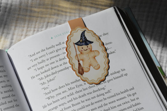 Handmade magnetic bookmark featuring a wizard gingerbread character design on a pink Keepsake House backing card