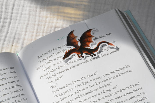 Handmade magnetic bookmark featuring a cute kawaii dragon design on a pink Keepsake House backing card