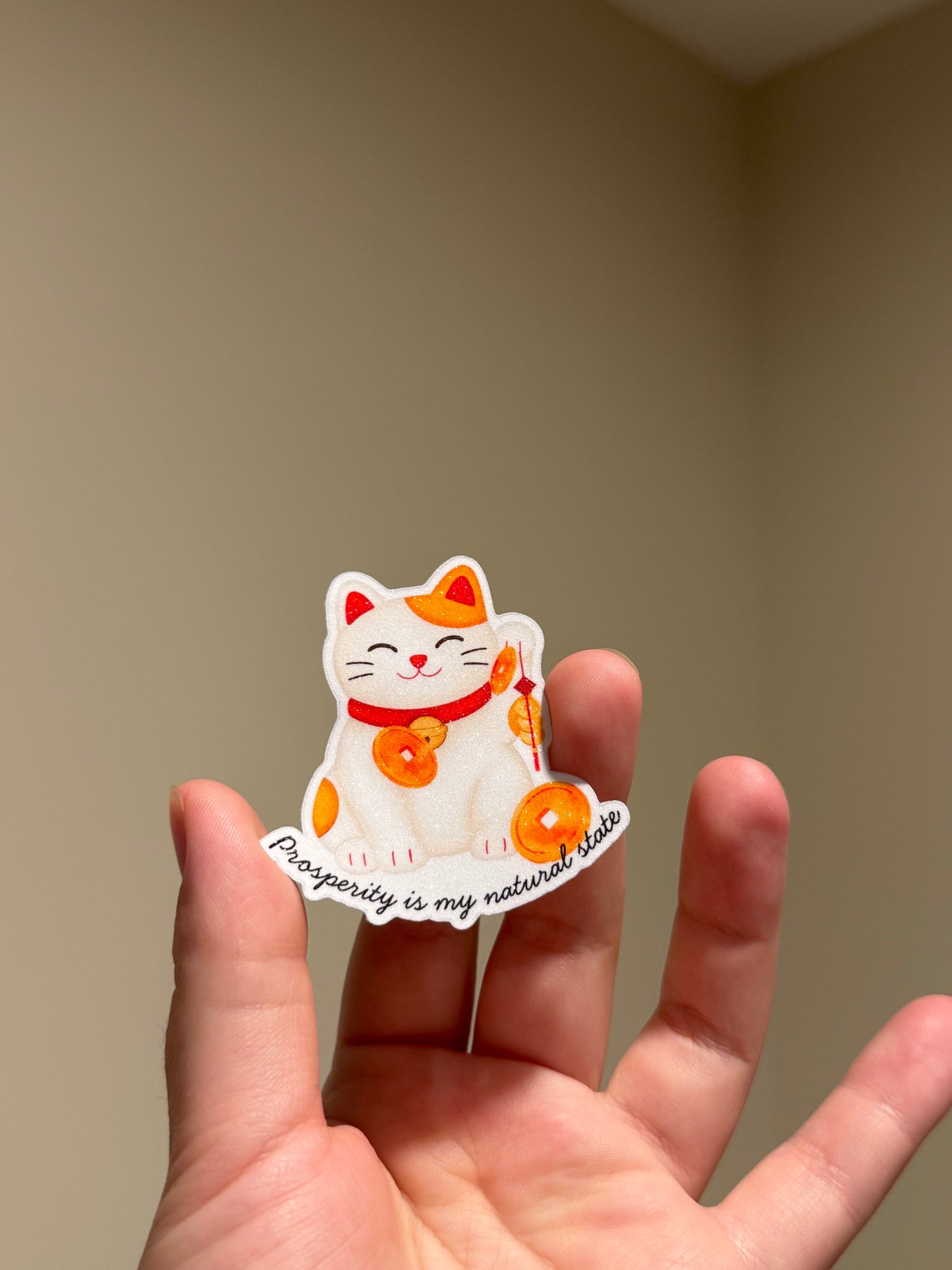Watercolor lucky cat glitter sticker featuring the affirmation "Prosperity is my natural state" for laptops, Kindles, journals, and planners.