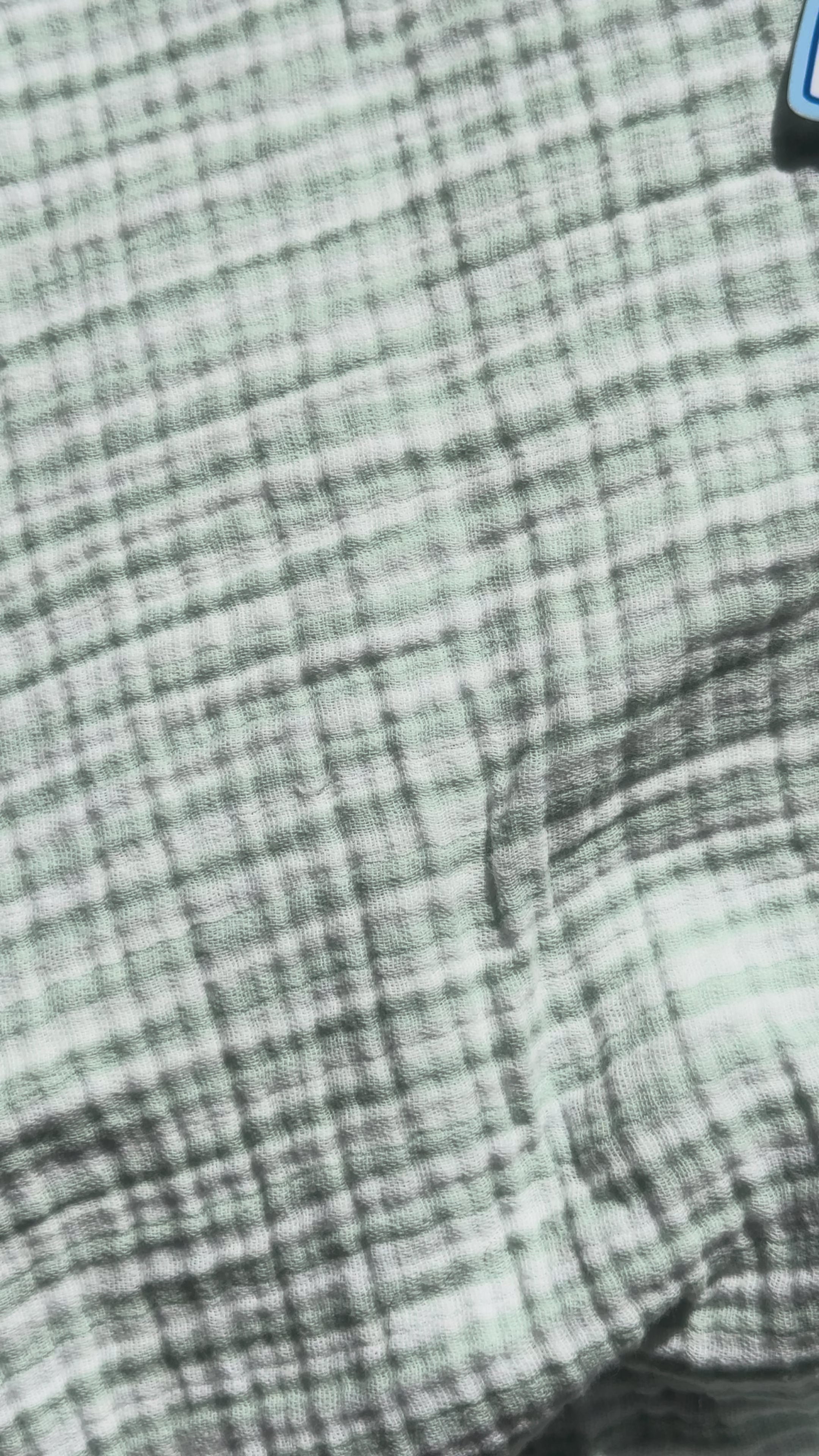 Close-up video of the "Reheated 3 Times Since Morning, Still Not Finished" coffee sticker featuring a floral mug and transparent laminate finish.