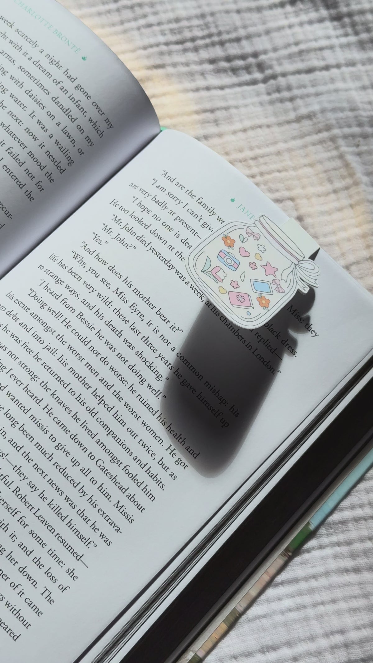 Cottagecore mason jar magnetic bookmark demo: cute jar design clips onto book or planner pages with strong magnet, shown on pink Keepsake House backing card