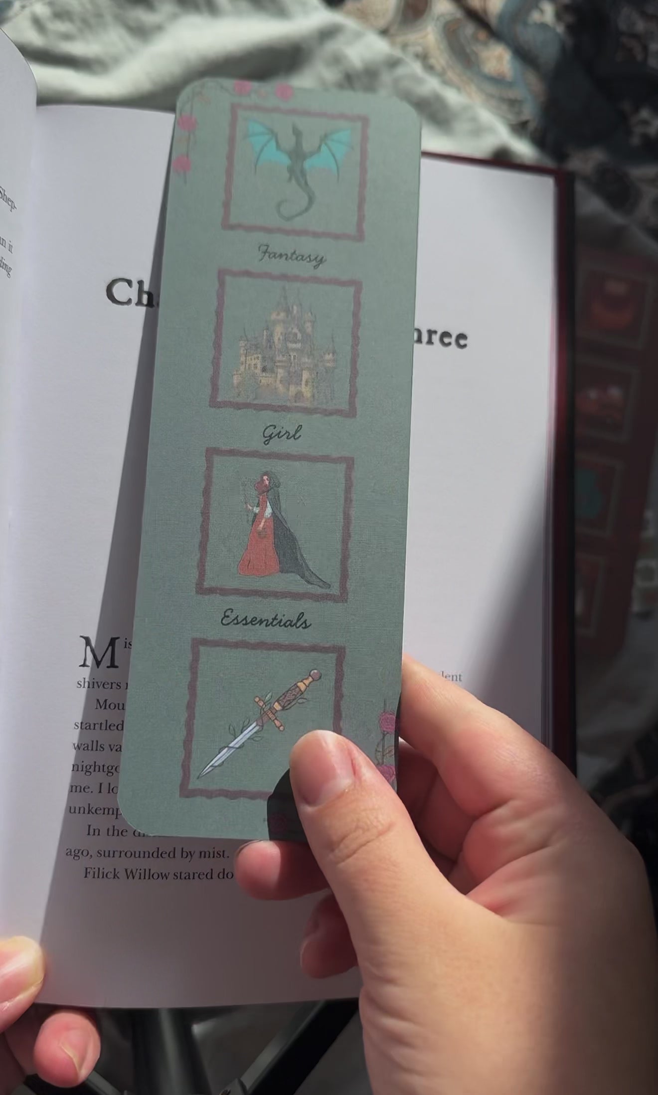 Video shows double-sided linen bookmark for fantasy readers