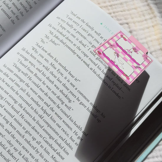 Silly goose magnetic bookmark demo: coquette pastel goose design clips securely onto book pages, shown on pink Keepsake House backing card with strong magnet