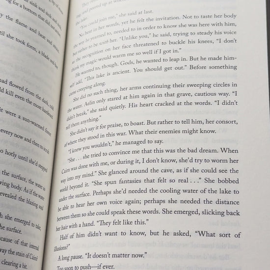 Video showcasing the botanical linen bookmark with the quote "Between the pages, I found peace" while marking pages in an open book.