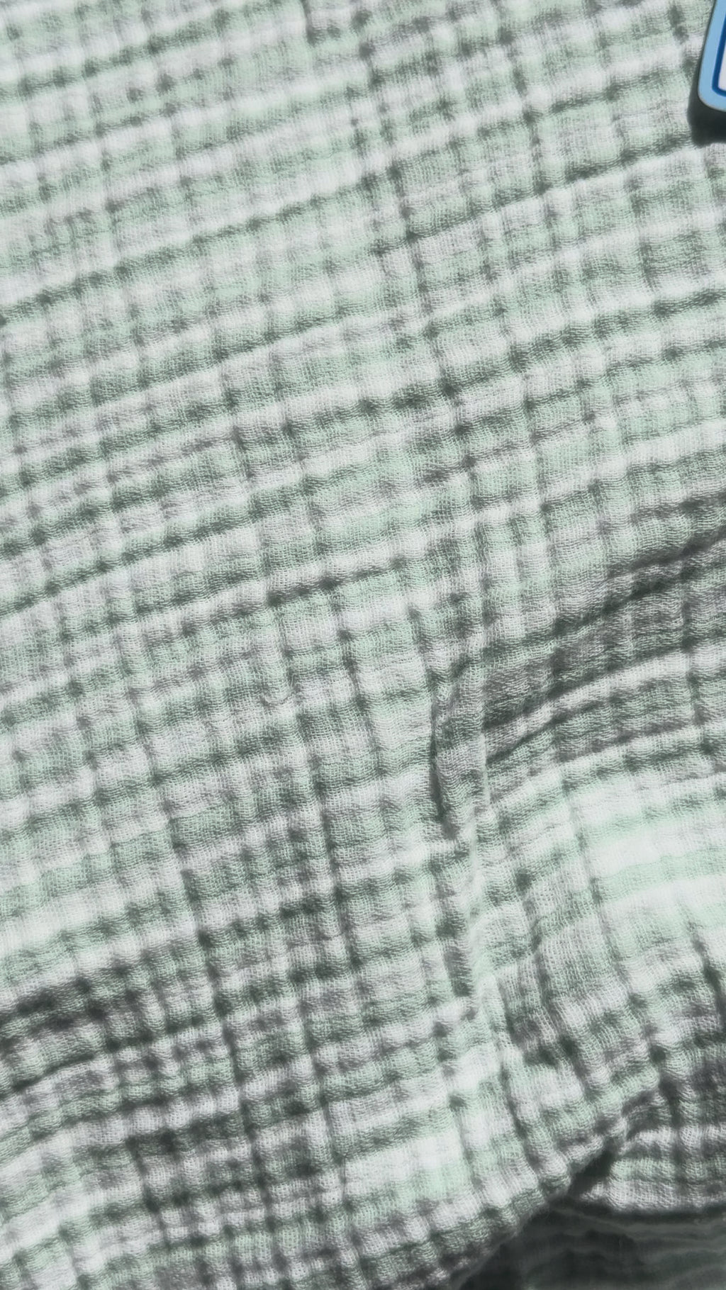 Close-up video of the "I'm My Kid's Favorite Napkin" funny mom sticker showing its glossy finish and playful parenting design.
